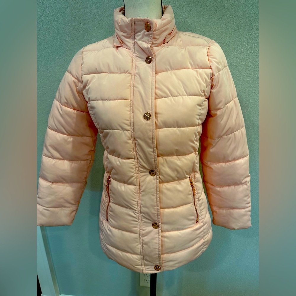 Justice girls thick puffer jacket, pale pink with rose gold snaps and zippers.
